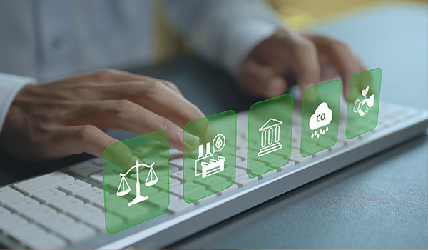 hands typing on a keyboard with icon graphics representing scales factory bank cloud and handshake emphasizing environmental law and regulation 9 topics related to sustainability
